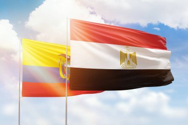 Sunny blue sky and flags of egypt and ecuador