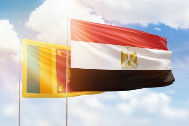Sunny blue sky and flags of egypt and sri lanka