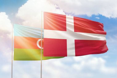 Sunny blue sky and flags of denmark and azerbaijan