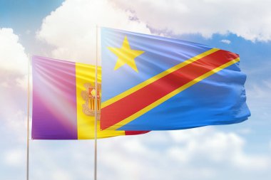 Sunny blue sky and flags of dr congo and andorra