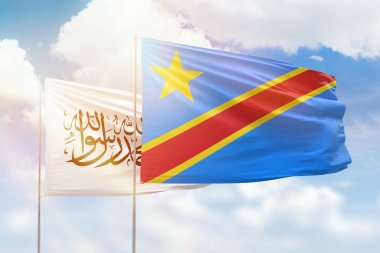 Sunny blue sky and flags of dr congo and afghanistan