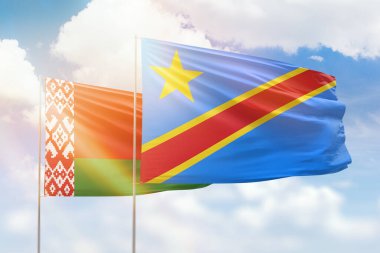 Sunny blue sky and flags of dr congo and belarus