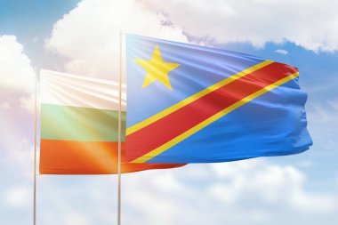 Sunny blue sky and flags of dr congo and bulgaria