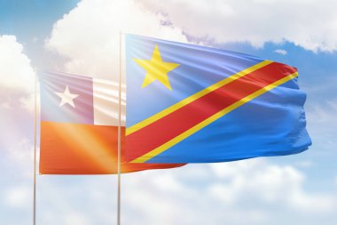 Sunny blue sky and flags of dr congo and chile