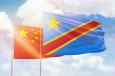 Sunny blue sky and flags of dr congo and china