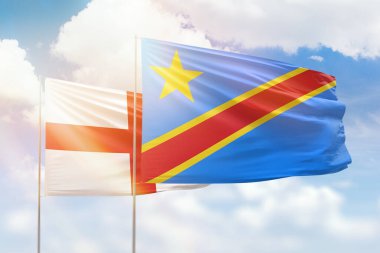 Sunny blue sky and flags of dr congo and england