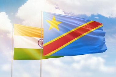 Sunny blue sky and flags of dr congo and india