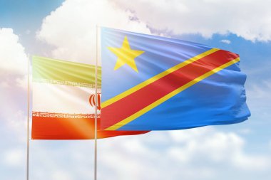 Sunny blue sky and flags of dr congo and iran