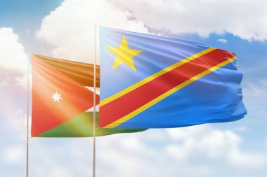 Sunny blue sky and flags of dr congo and jordan