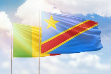 Sunny blue sky and flags of dr congo and mali