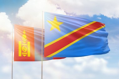 Sunny blue sky and flags of dr congo and mongolia