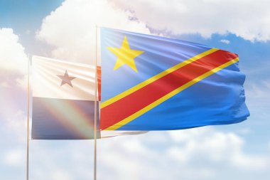 Sunny blue sky and flags of dr congo and panama