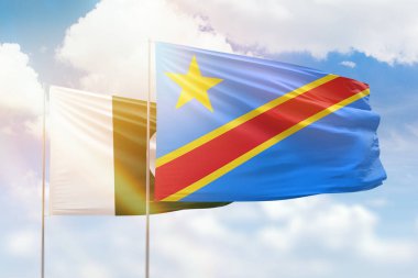 Sunny blue sky and flags of dr congo and pakistan