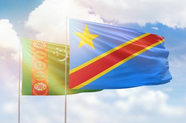 Sunny blue sky and flags of dr congo and turkmenistan