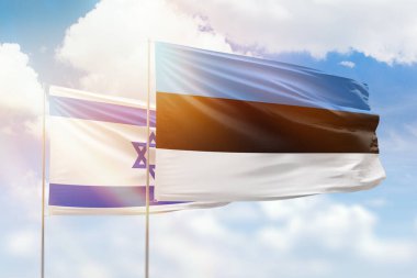 Sunny blue sky and flags of estonia and israel