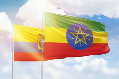 Sunny blue sky and flags of ethiopia and ecuador