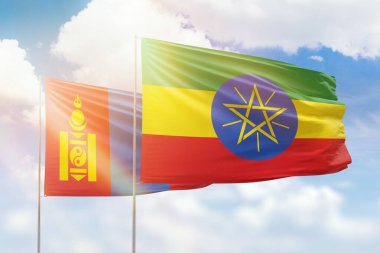 Sunny blue sky and flags of ethiopia and mongolia