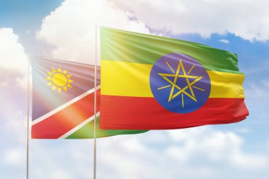 Sunny blue sky and flags of ethiopia and namibia