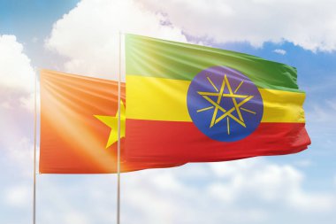 Sunny blue sky and flags of ethiopia and vietnam