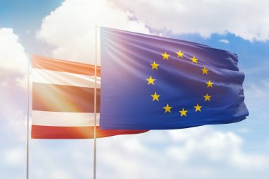 Sunny blue sky and flags of european union and thailand