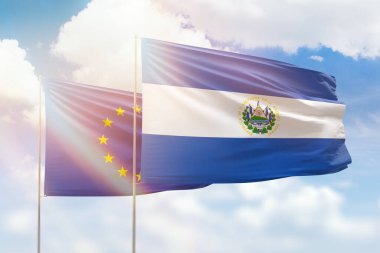 Sunny blue sky and flags of el salvador and european union