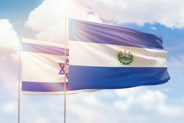 Sunny blue sky and flags of el salvador and israel