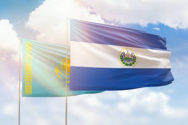 Sunny blue sky and flags of el salvador and kazakhstan