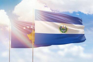 Sunny blue sky and flags of el salvador and kosovo