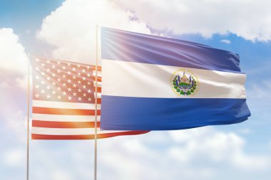 Sunny blue sky and flags of el salvador and usa