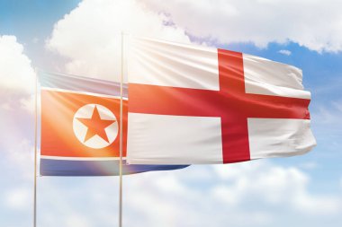Sunny blue sky and flags of england and north korea