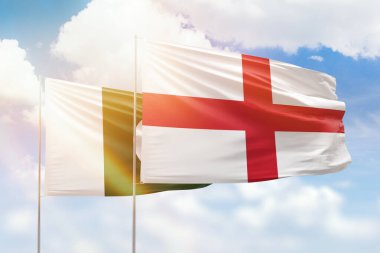 Sunny blue sky and flags of england and pakistan