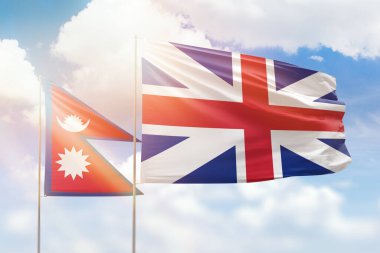 Sunny blue sky and flags of great britain and nepal