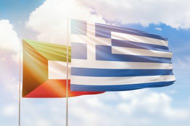 Sunny blue sky and flags of greece and kuwait