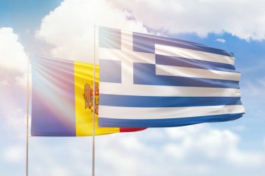Sunny blue sky and flags of greece and moldova
