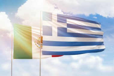 Sunny blue sky and flags of greece and mexico