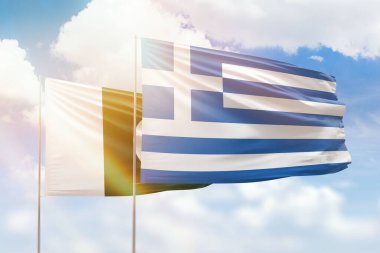 Sunny blue sky and flags of greece and pakistan