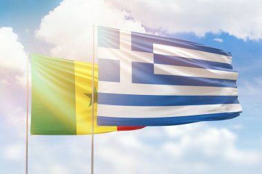 Sunny blue sky and flags of greece and senegal