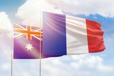 Sunny blue sky and flags of france and australia