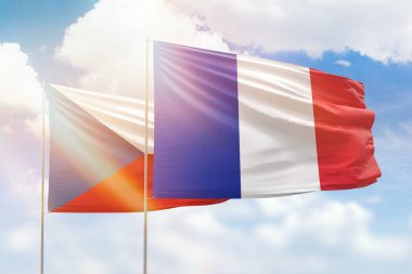 Sunny blue sky and flags of france and czechia