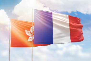 Sunny blue sky and flags of france and hong kong
