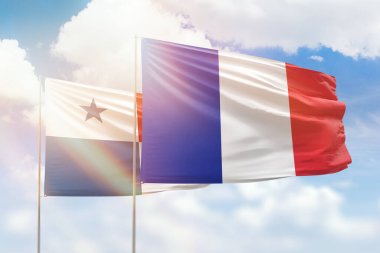 Sunny blue sky and flags of france and panama
