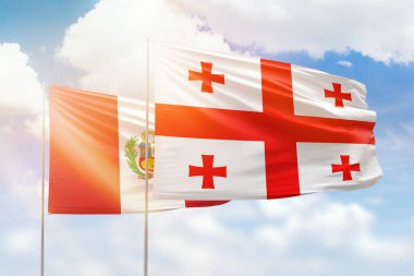 Sunny blue sky and flags of georgia and peru