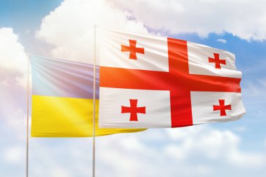 Sunny blue sky and flags of georgia and ukraine
