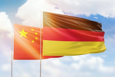 Sunny blue sky and flags of germany and china