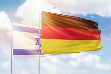 Sunny blue sky and flags of germany and israel