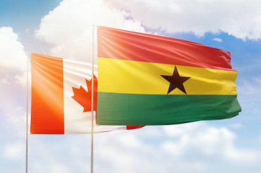 Sunny blue sky and flags of ghana and canada