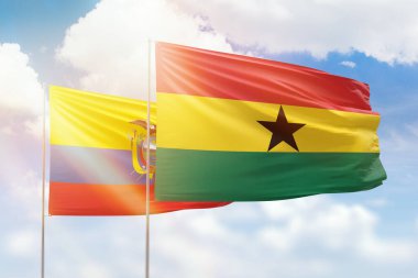 Sunny blue sky and flags of ghana and ecuador