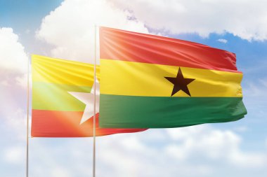 Sunny blue sky and flags of ghana and myanmar