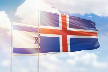 Sunny blue sky and flags of iceland and israel
