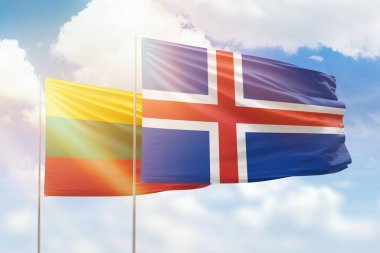 Sunny blue sky and flags of iceland and lithuania